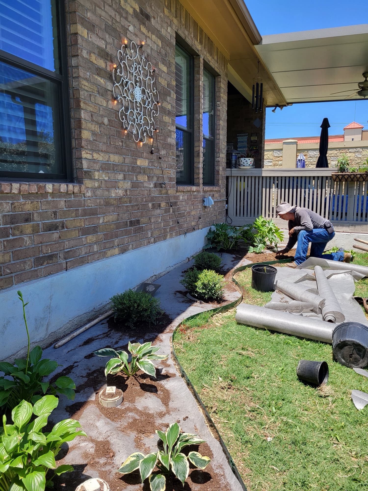 Plant bed with river rock installation