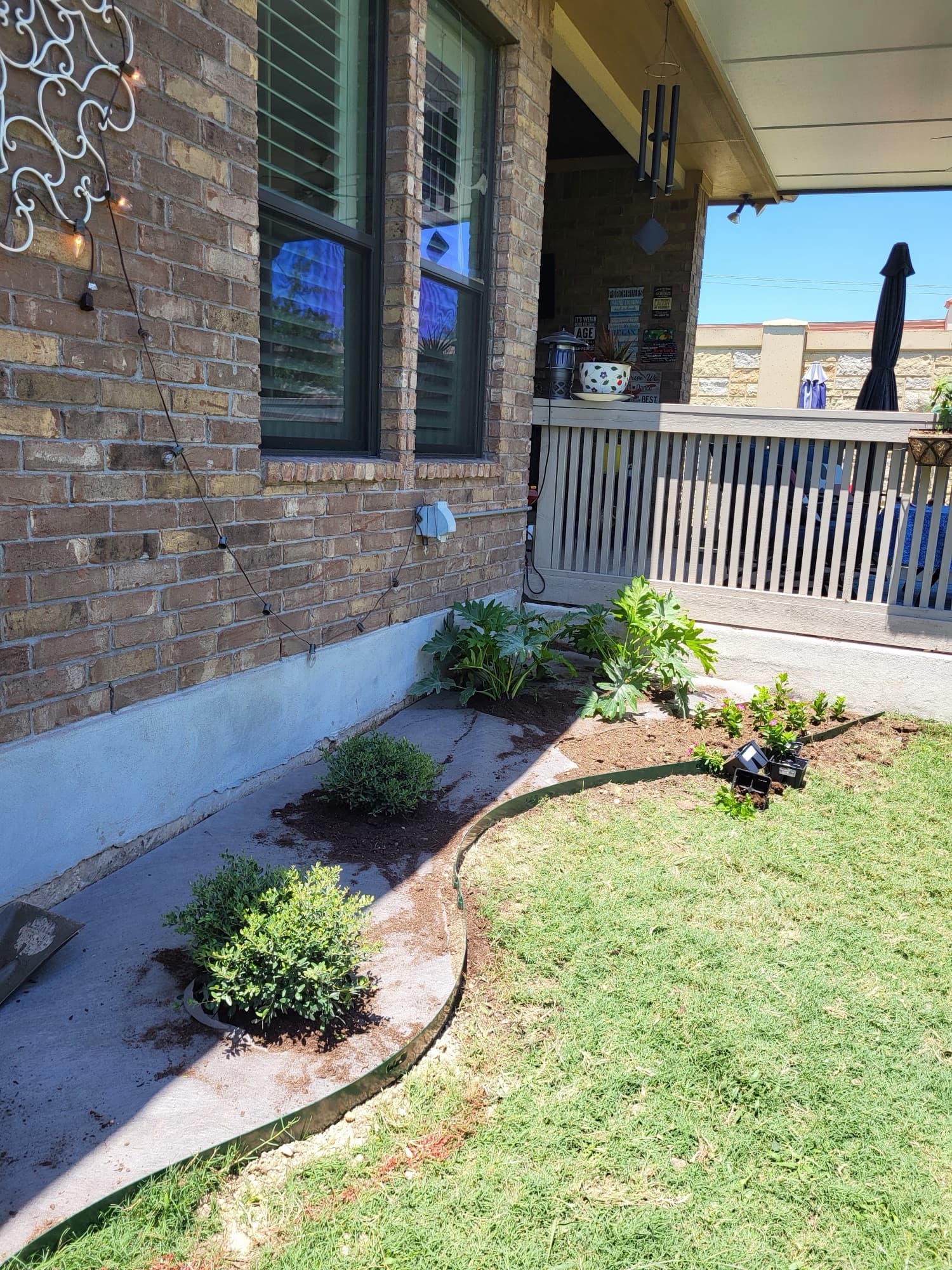 Plant bed with river rock installation