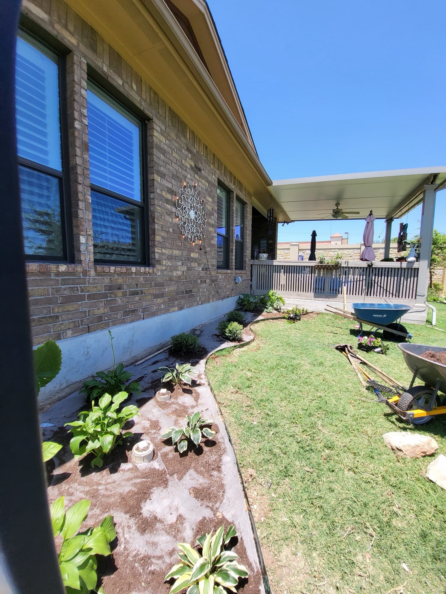 Plant bed with river rock installation